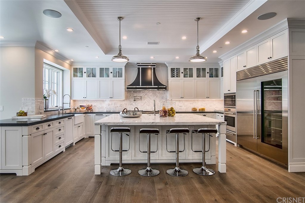 5546 Jed Smith Road Hidden Hills, CA 91302 - Photo 15 of 75 a kitchen with stainless steel appliances granite countertop a sink cabinets and wooden floor