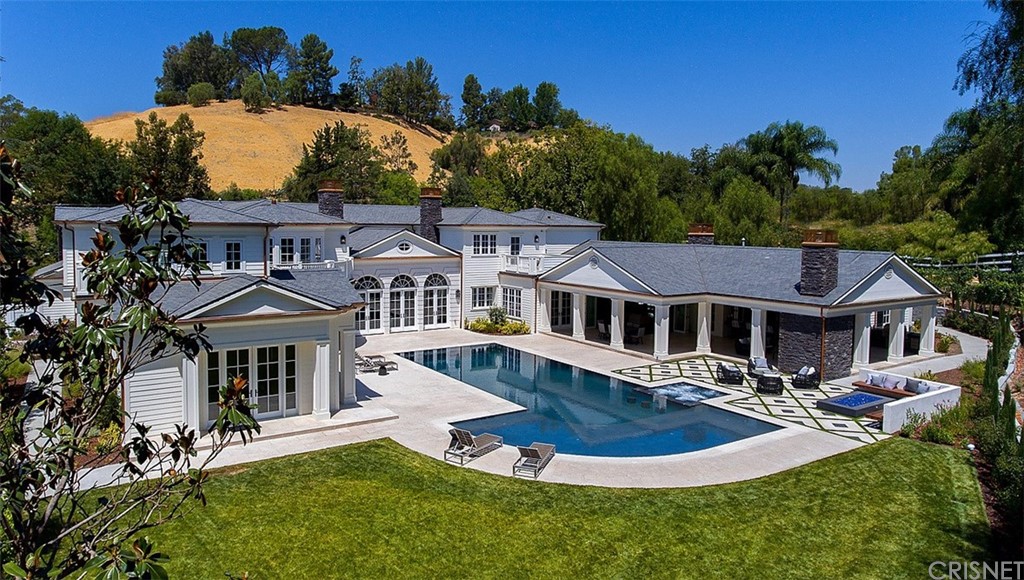 5546 Jed Smith Road Hidden Hills, CA 91302 - Photo 3 of 75 a front view of a house with yard swimming pool and outdoor seating
