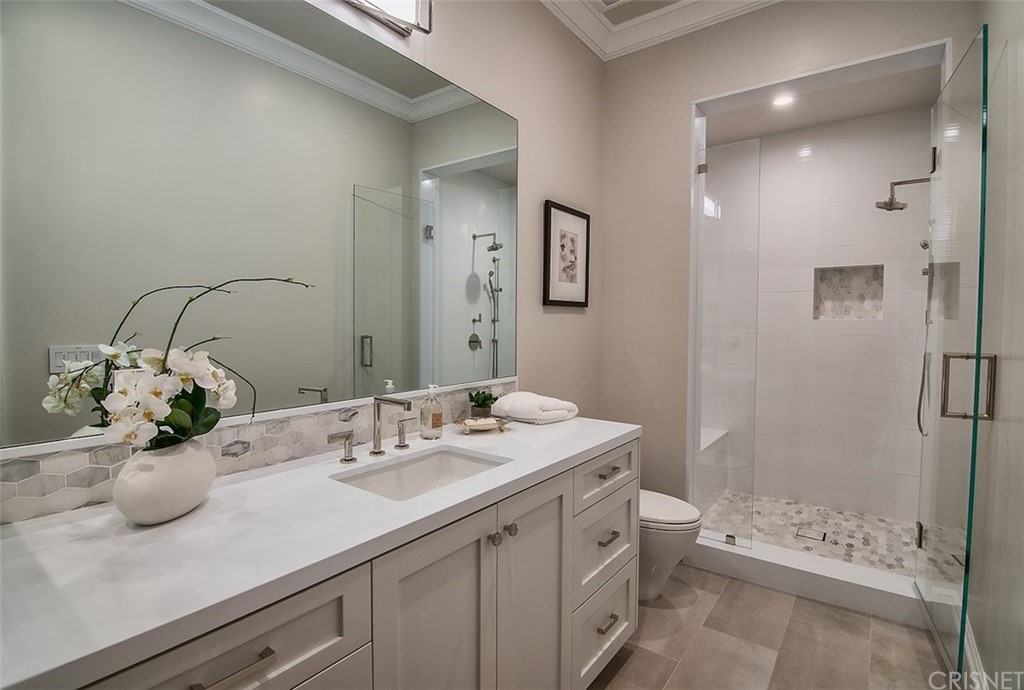 5546 Jed Smith Road Hidden Hills, CA 91302 - Photo 38 of 75 a bathroom with a sink and a mirror