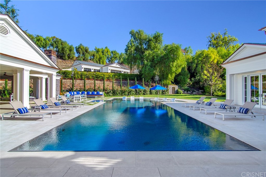 5546 Jed Smith Road Hidden Hills, CA 91302 - Photo 47 of 75 a view of a swimming pool with outdoor seating