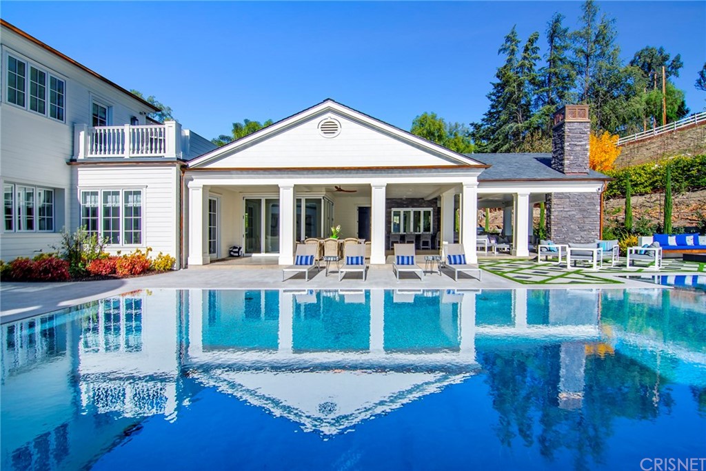 5546 Jed Smith Road Hidden Hills, CA 91302 - Photo 51 of 75 a view of a house with pool and chairs
