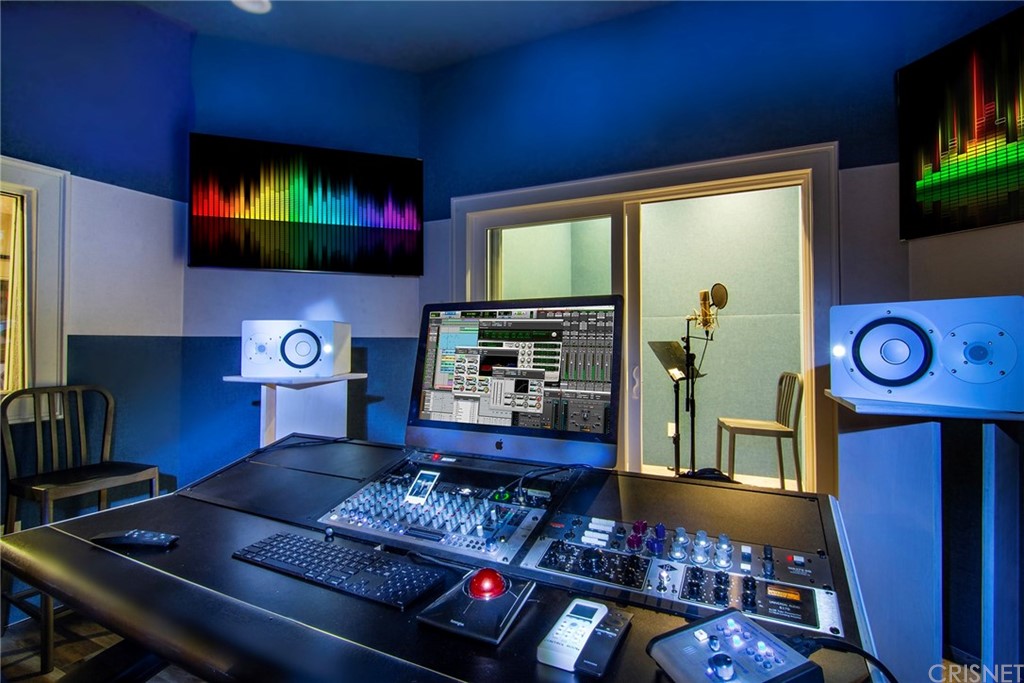 5546 Jed Smith Road Hidden Hills, CA 91302 - Photo 65 of 75 a living room with furniture and a flat screen tv