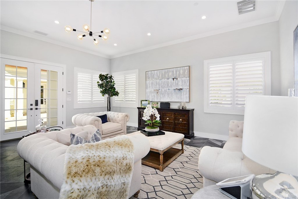 5546 Jed Smith Road Hidden Hills, CA 91302 - Photo 66 of 75 a living room with furniture and a fireplace