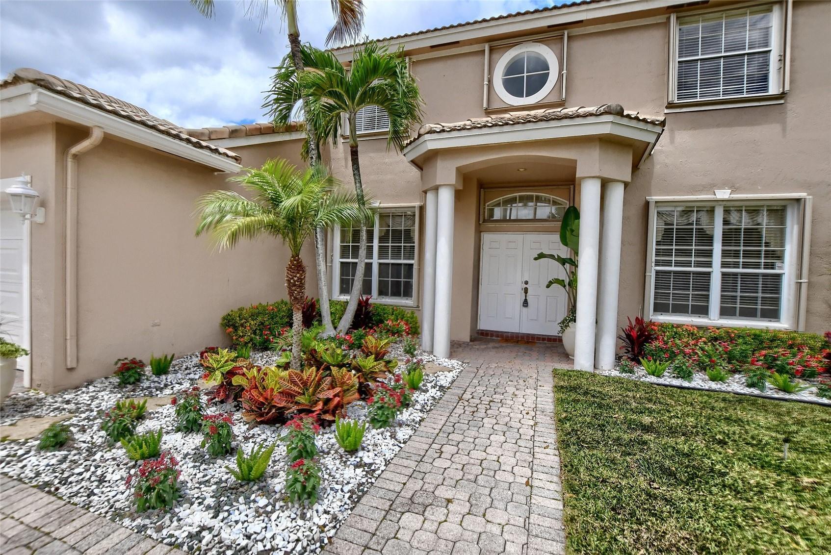 12920 Hyland Circle Boca Raton, FL 33428 - Photo 19 of 31 a front view of a house