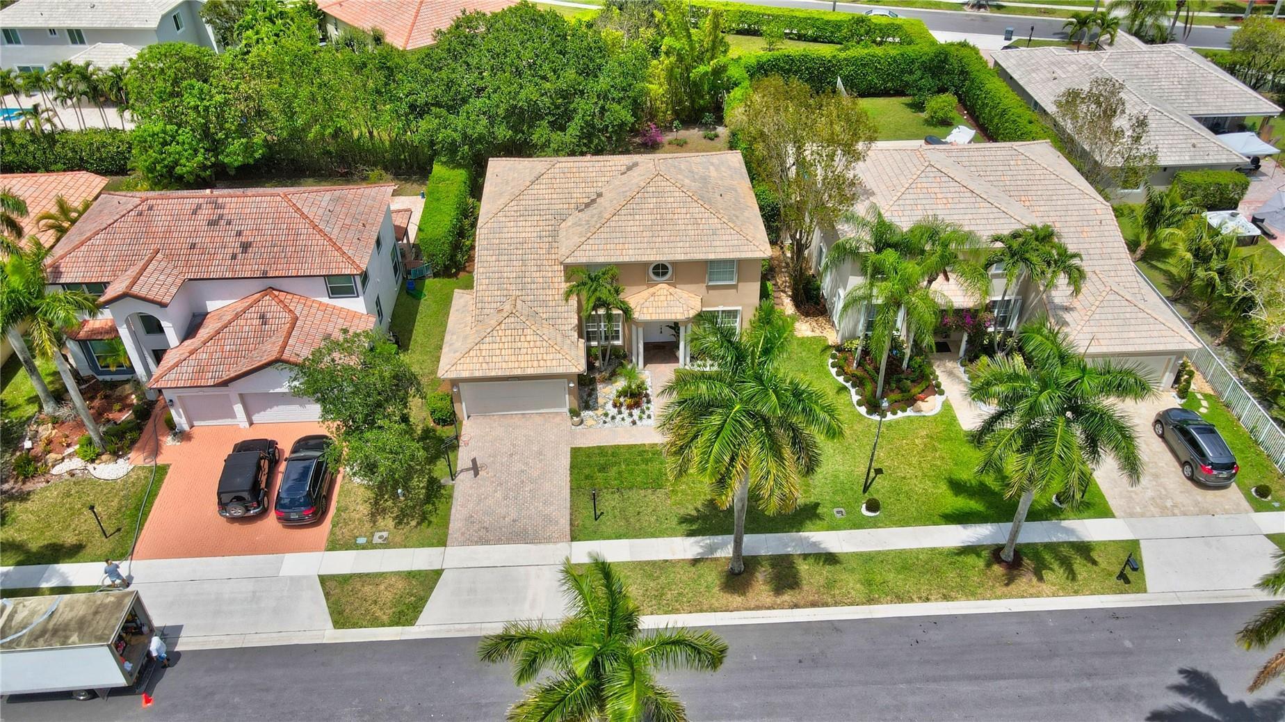 12920 Hyland Circle Boca Raton, FL 33428 - Photo 21 of 31 an aerial view of a house with a garden and swimming pool