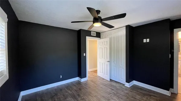 a view of an empty room and wooden floor