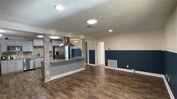 a view of a kitchen with a sink