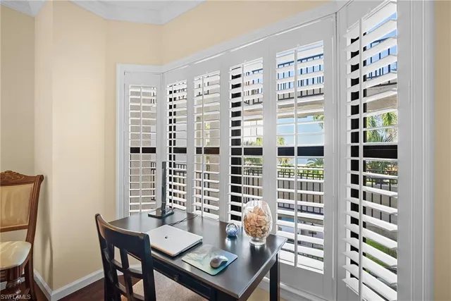 a view of a room with furniture and a window