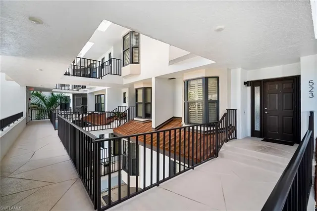 a view of balcony with deck and outdoor seating