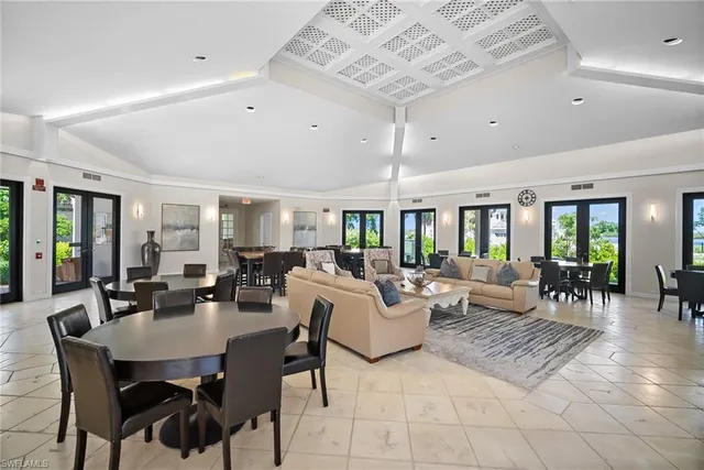 a living room with lots of furniture and a table