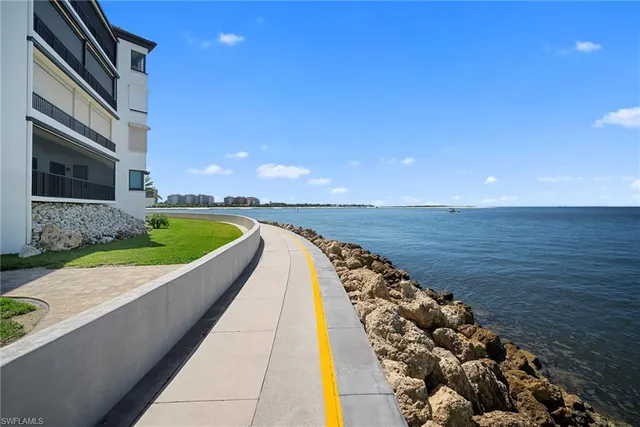 a view of a swimming pool with a lounge chair