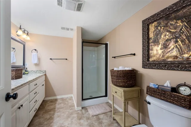 a bathroom with a sink a mirror and shower