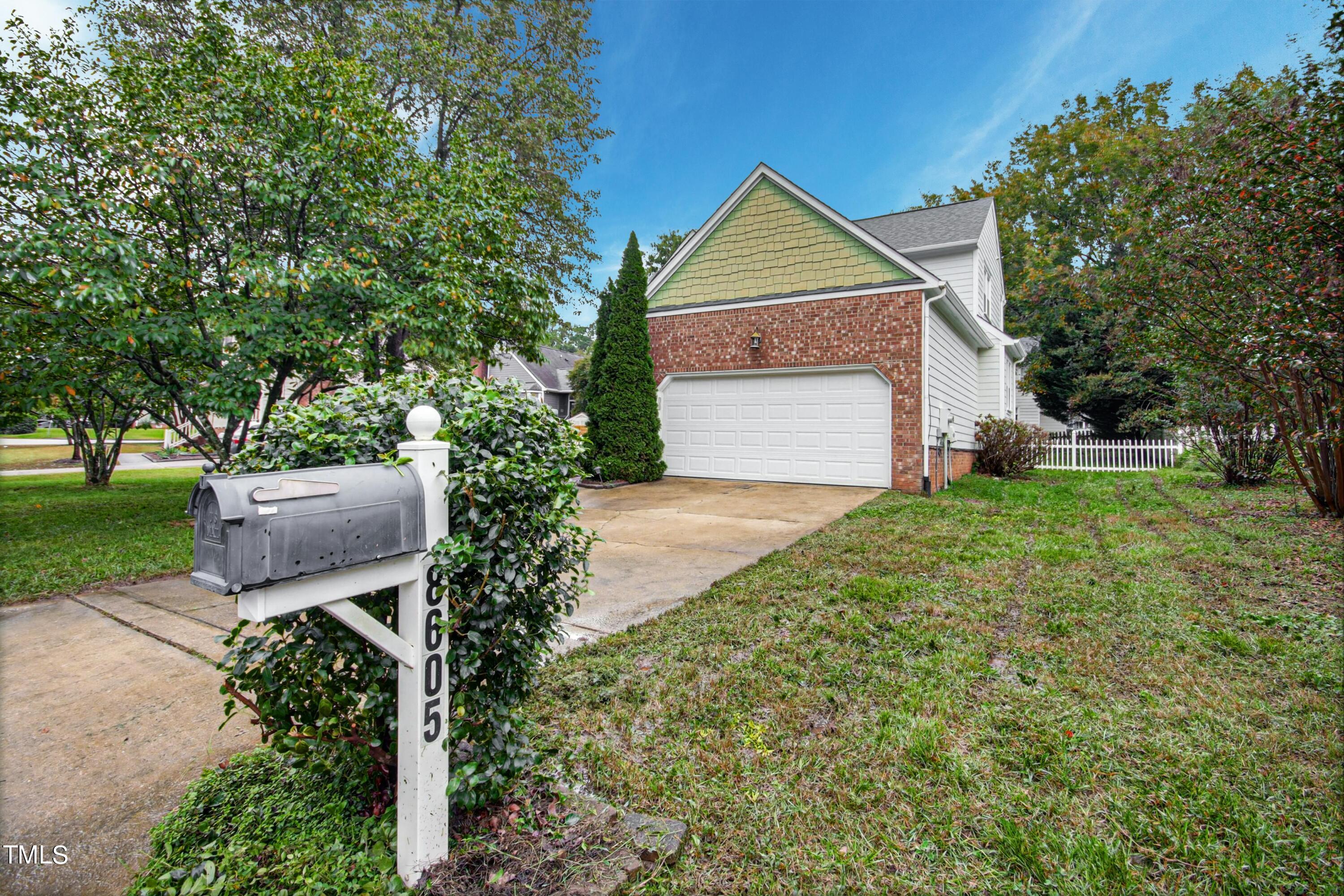 8605 Yucca Trail Raleigh, NC 27615 - Photo 2 of 42 a front view of a house with garden