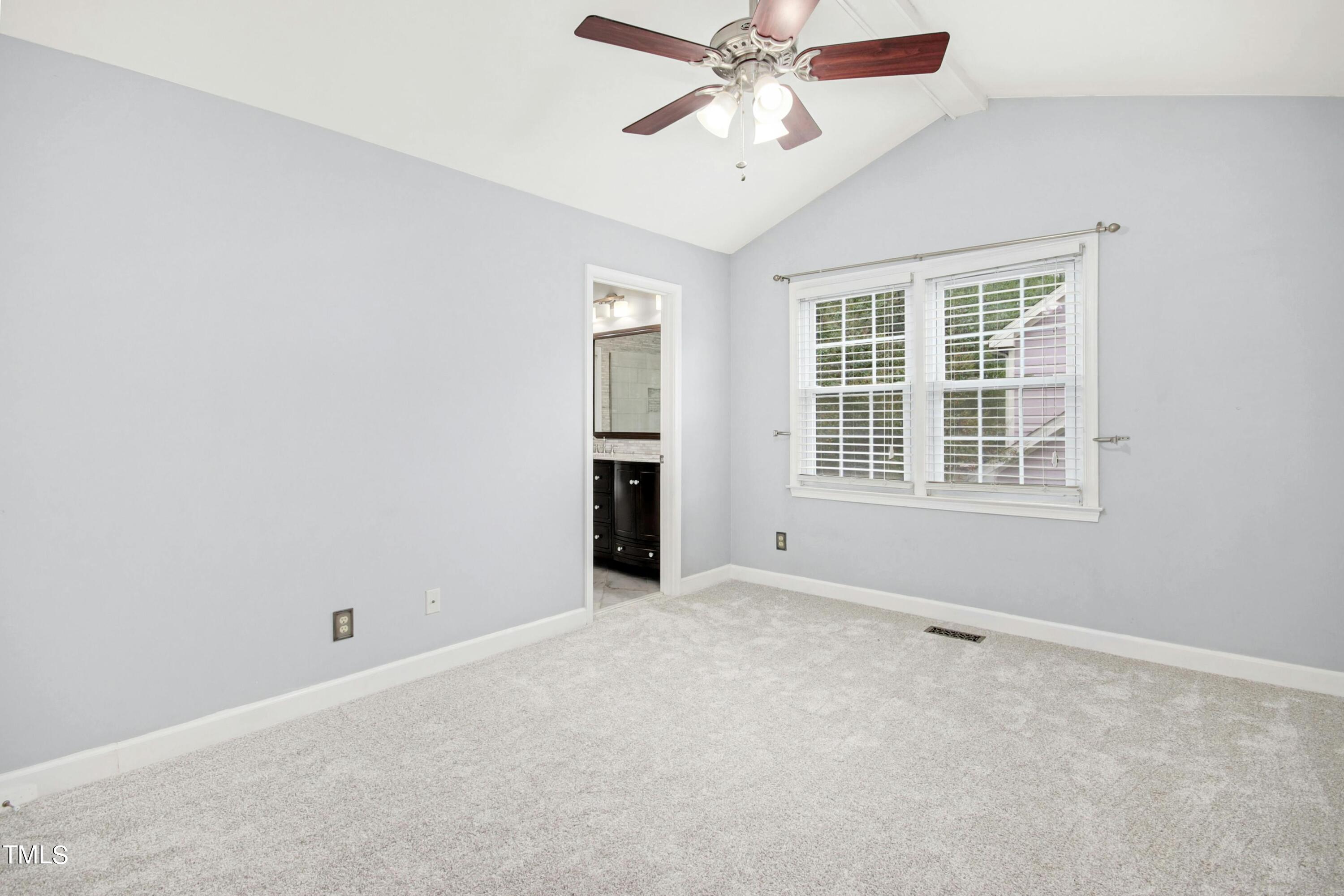 8605 Yucca Trail Raleigh, NC 27615 - Photo 21 of 42 an empty room with windows and fan