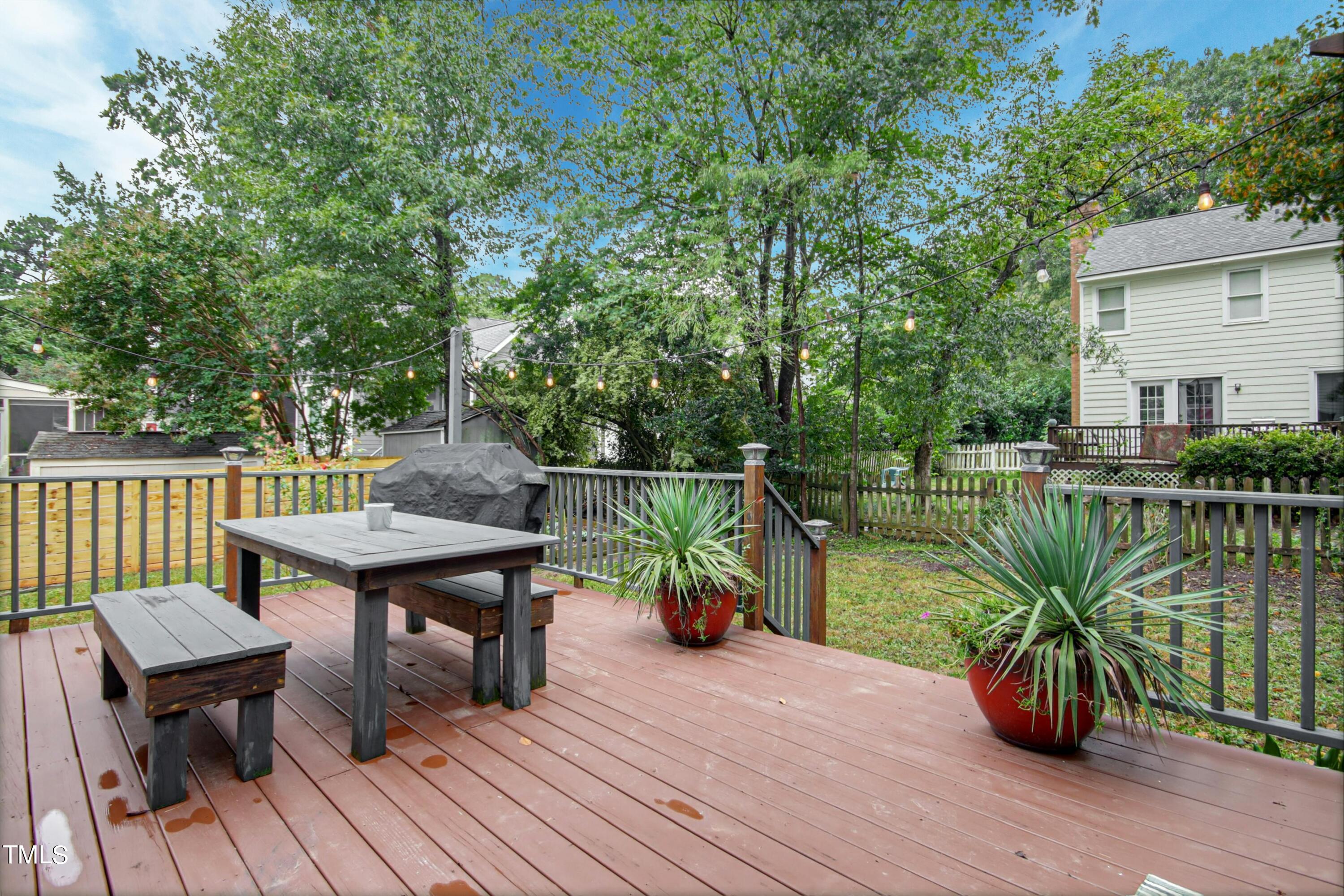 8605 Yucca Trail Raleigh, NC 27615 - Photo 29 of 42 a view of a deck with chairs and wooden floor