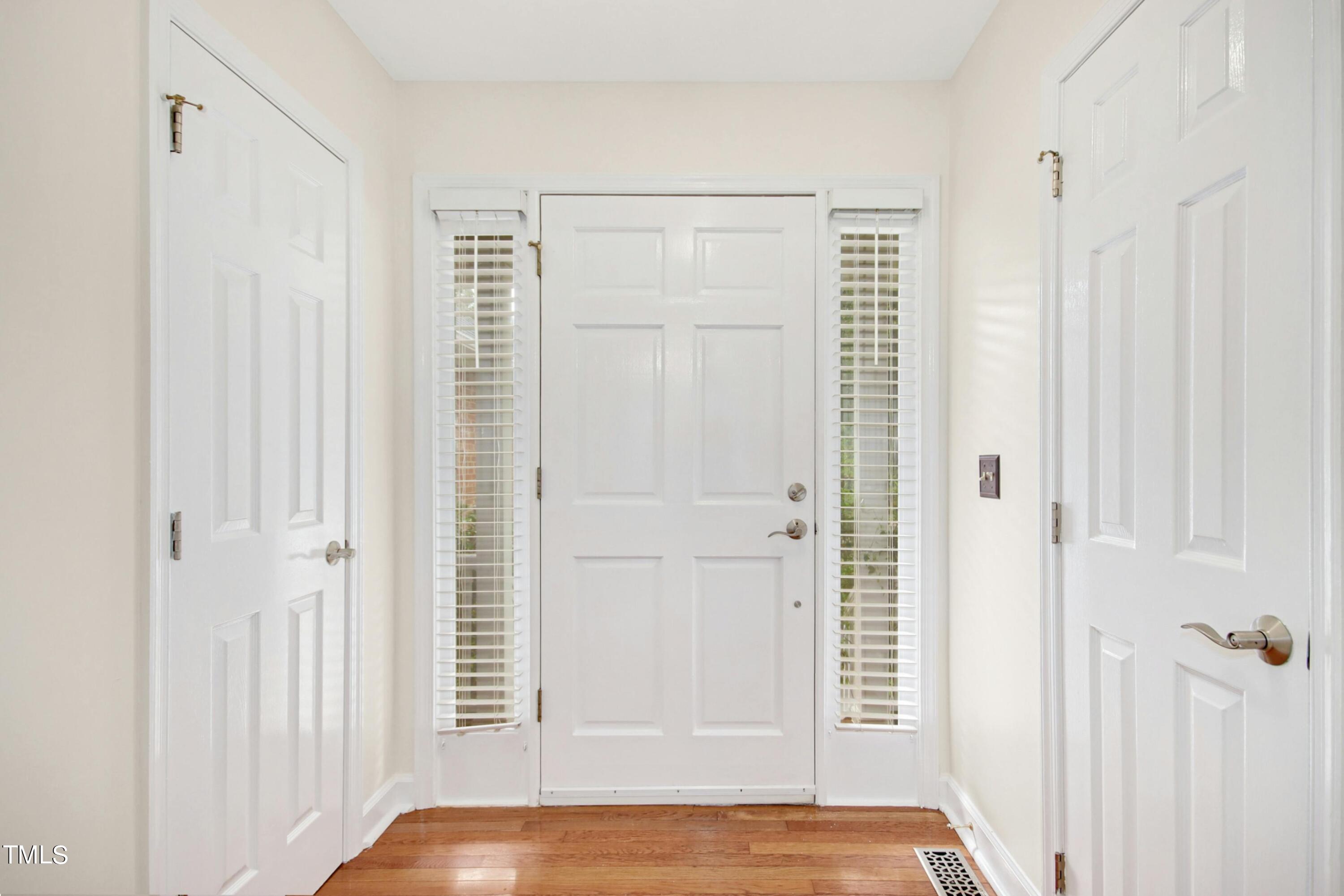 8605 Yucca Trail Raleigh, NC 27615 - Photo 3 of 42 a view of front door with wooden floor