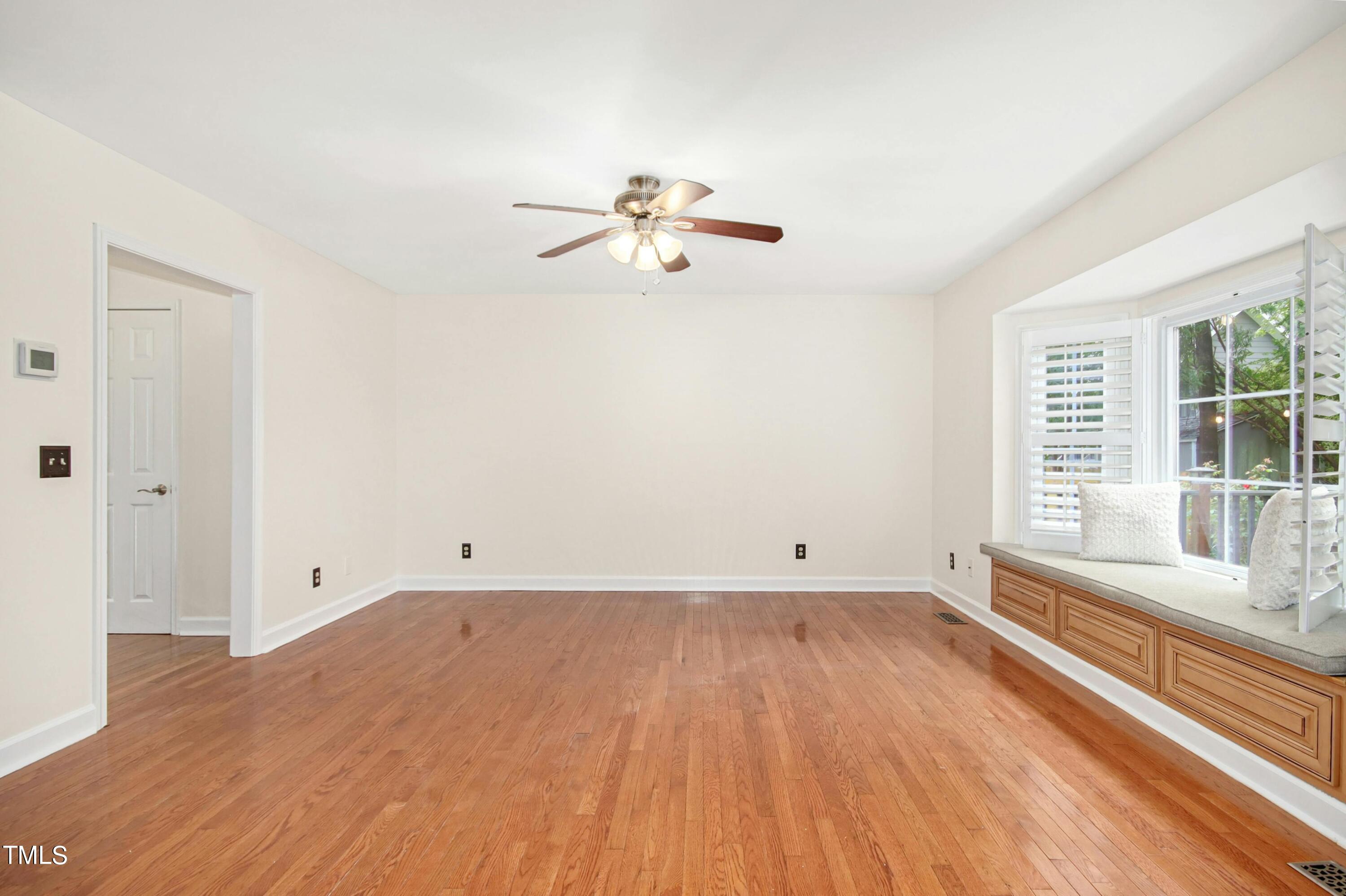 8605 Yucca Trail Raleigh, NC 27615 - Photo 7 of 42 wooden floor in an empty room with a window