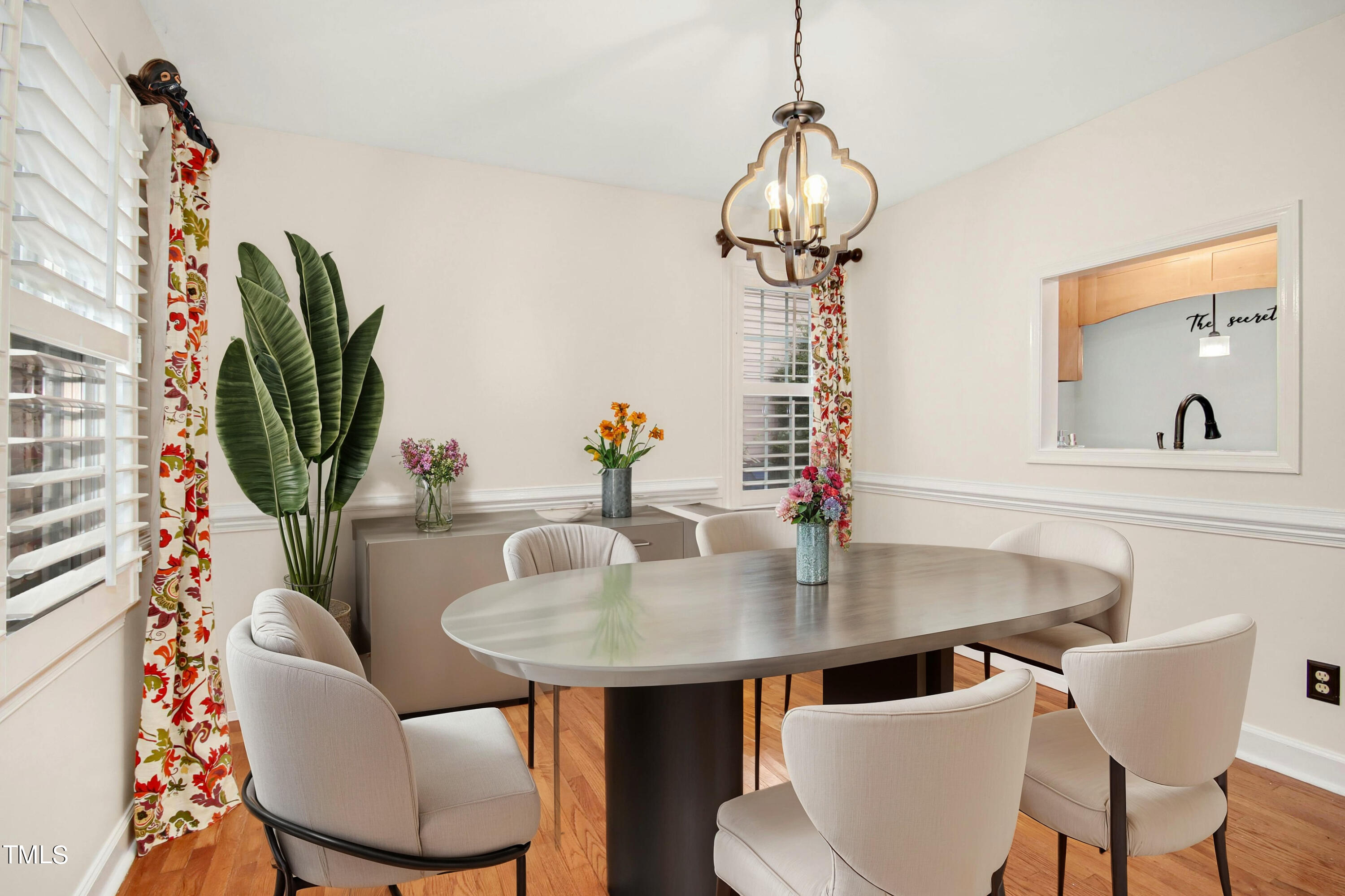 8605 Yucca Trail Raleigh, NC 27615 - Photo 10 of 42 a view of a dining room with furniture wooden floor and chandelier