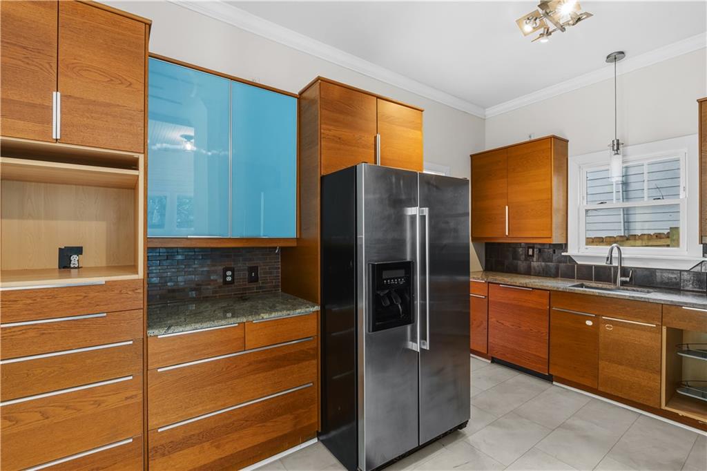1440 Everhart Street Southwest Atlanta, GA 30310 - Photo 15 of 27 a kitchen with stainless steel appliances granite countertop a refrigerator and a sink