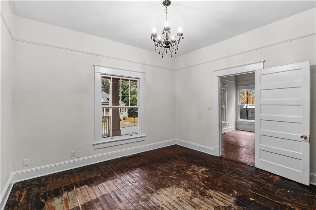 1440 Everhart Street Southwest Atlanta, GA 30310 - Photo 21 of 27 a view of a room with wooden floor closet and windows