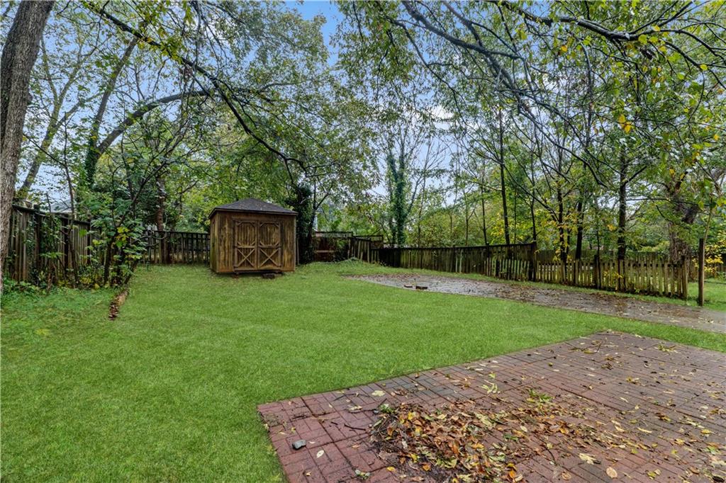 1440 Everhart Street Southwest Atlanta, GA 30310 - Photo 23 of 27 a view of a backyard with large trees