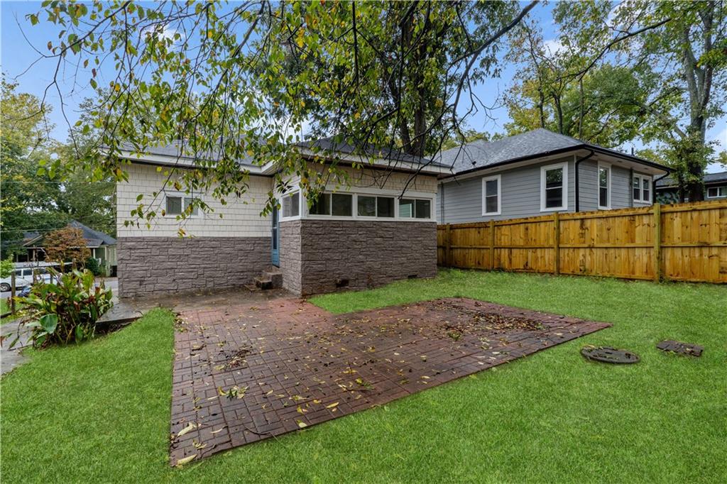 1440 Everhart Street Southwest Atlanta, GA 30310 - Photo 24 of 27 a front view of house with yard and green space