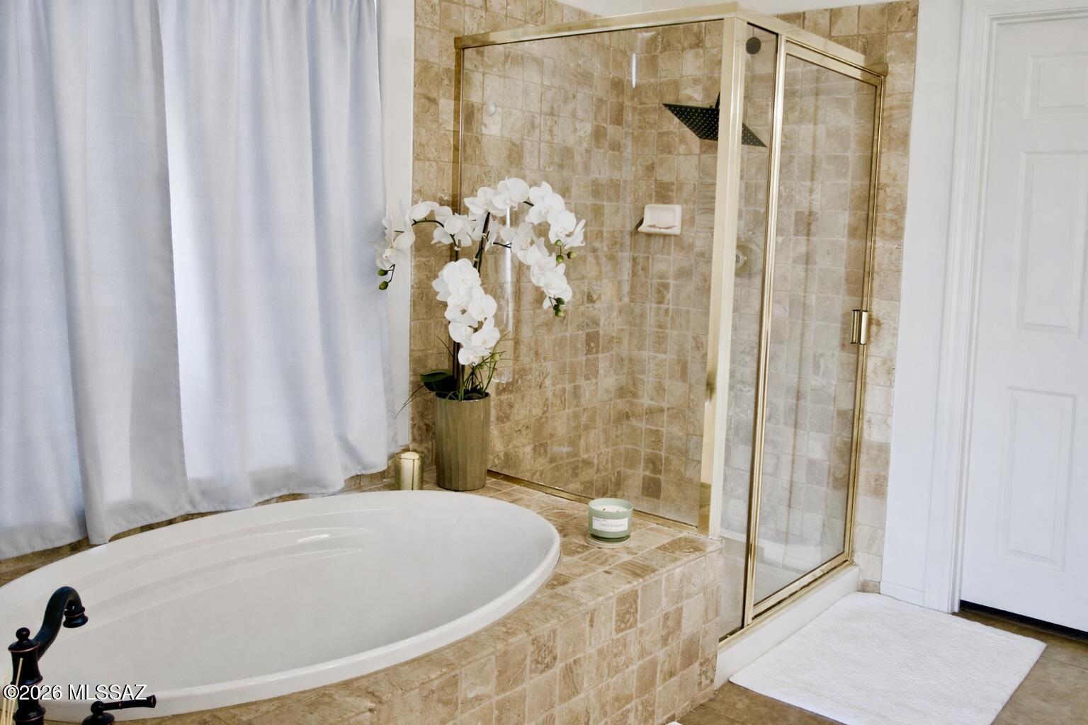 5202 Spring View Drive Tucson, AZ 85749 - Photo 31 of 49 a bathroom with a tub and shower