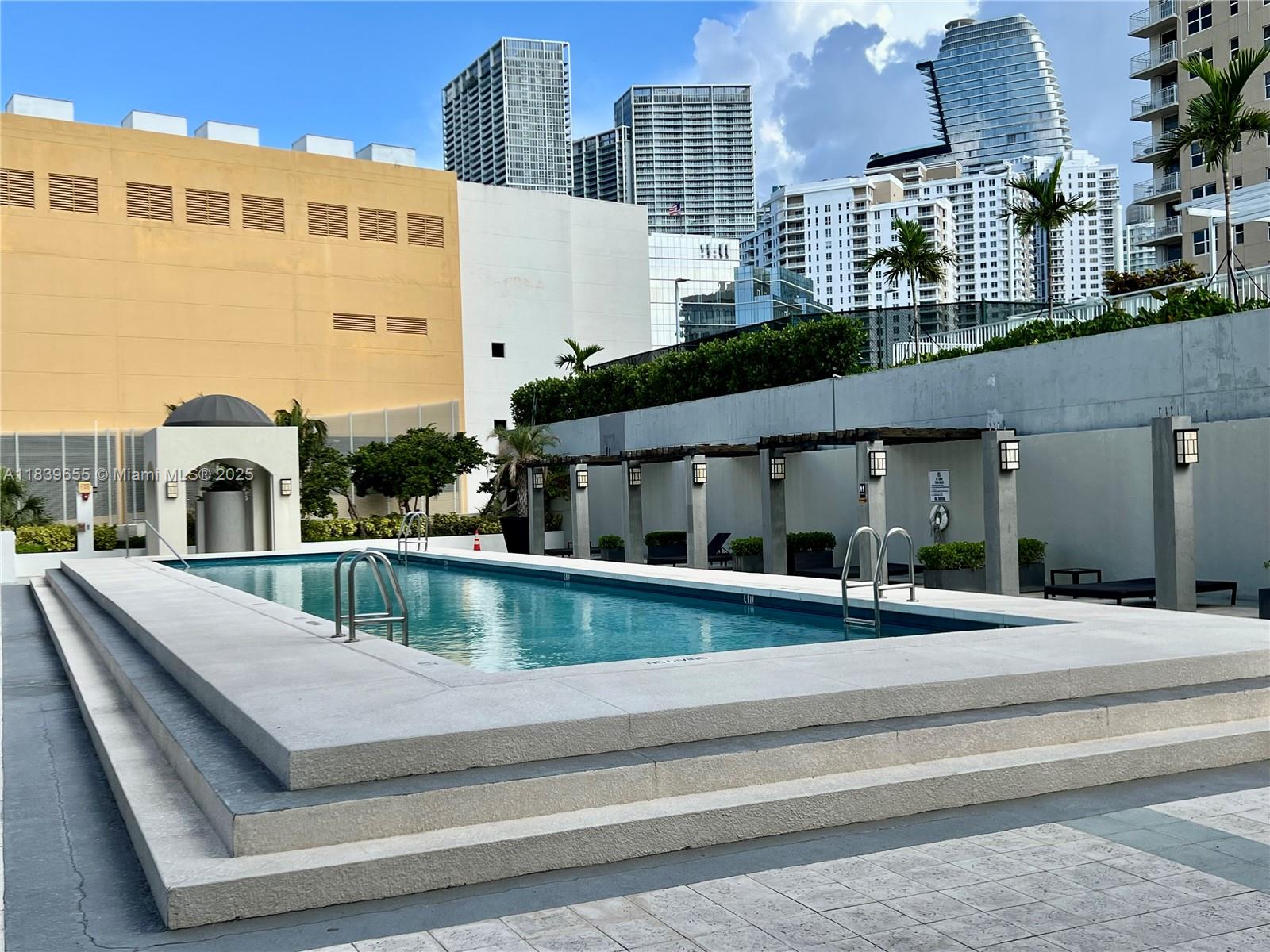 Brickell Miami, FL 33131 - Photo 11 of 32 a view of a building with a balcony