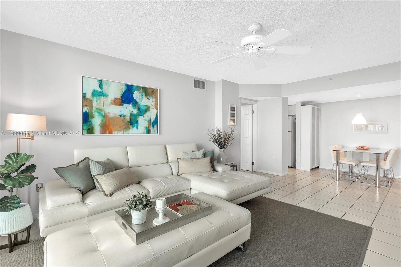 Brickell Miami, FL 33131 - Photo 2 of 32 a living room with furniture and a chandelier