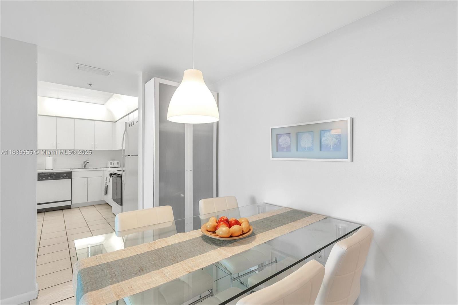 Brickell Miami, FL 33131 - Photo 27 of 32 a living room with furniture and a table