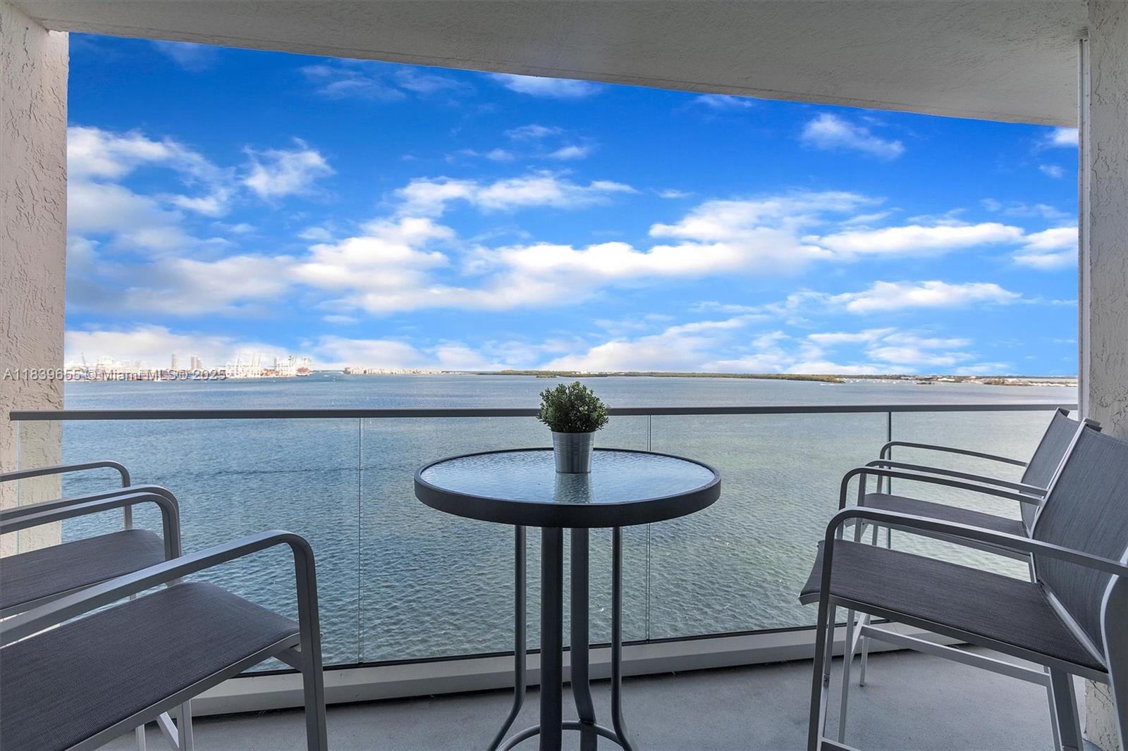 Brickell Miami, FL 33131 - Photo 30 of 32 a view of a balcony with chair and a table
