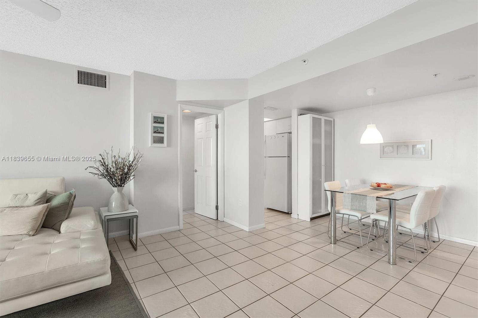 Brickell Miami, FL 33131 - Photo 5 of 32 a living room with furniture and a potted plant