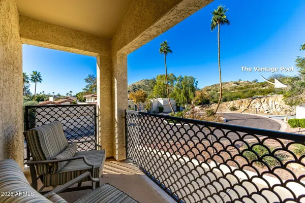 a view of a balcony with chairs