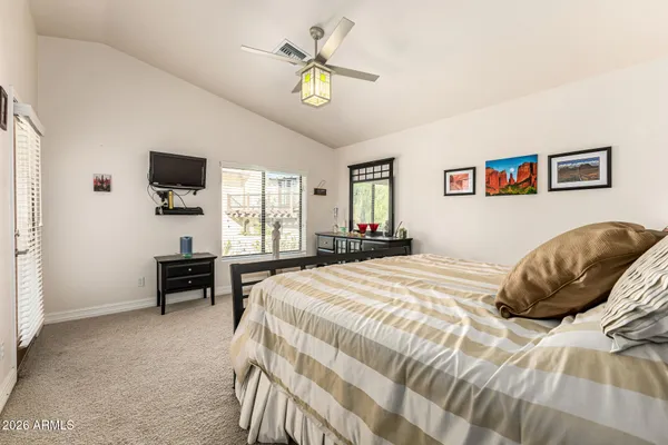a bedroom with a bed and a dresser