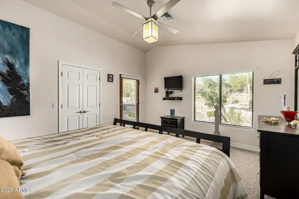 a bedroom with a bed and a closet