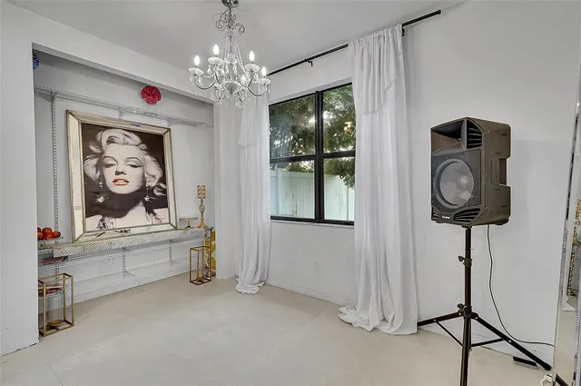 a view of room with furniture and chandelier