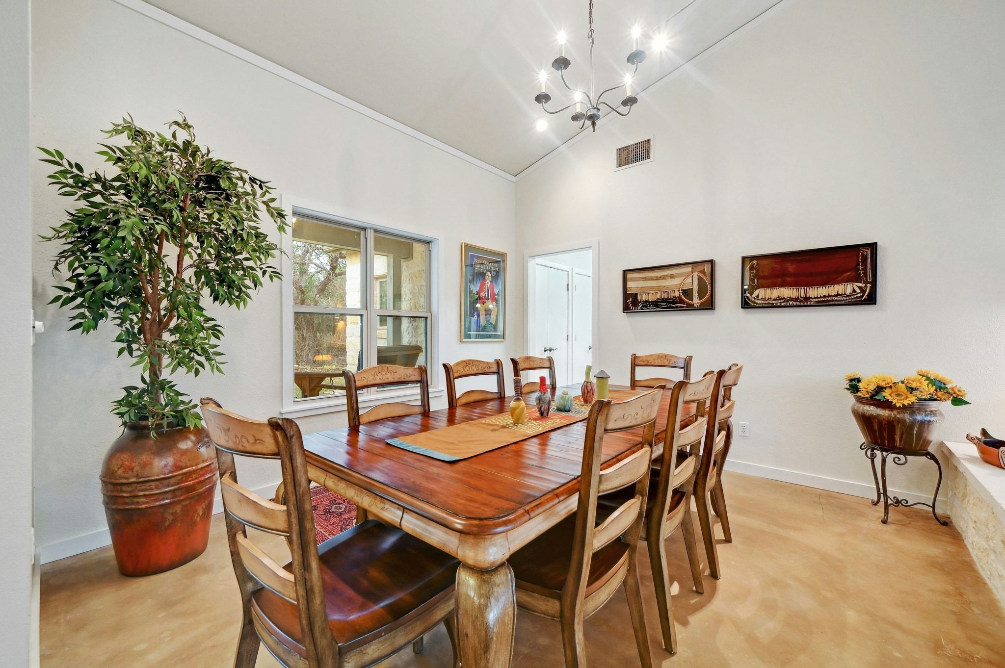 2147 Tejas Trail Blanco, TX 78606 - Photo 8 of 29 a view of a dining room with furniture and chandelier