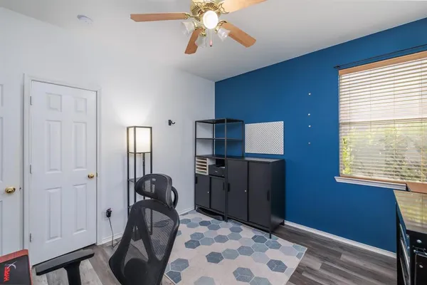 a workspace with furniture and window