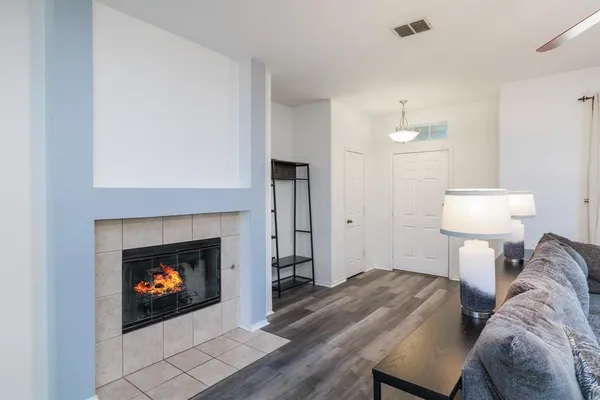 a bedroom with a bed and a fireplace