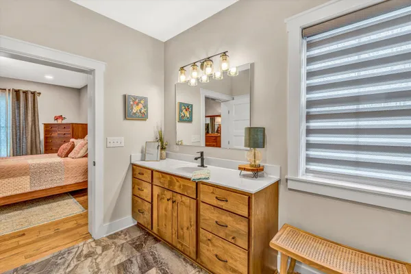 a bathroom with a sink and a mirror