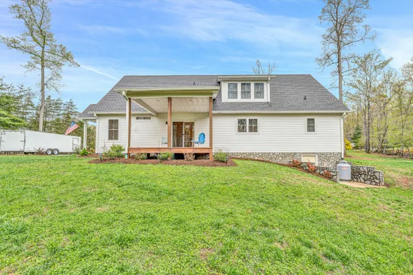 a view of a patio with table and chairs and potted plants