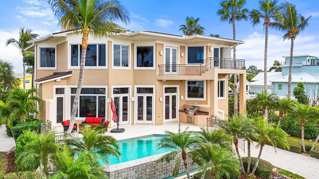 761 Norton Street Longboat Key, FL 34228 - Photo 59 of 66 a front view of a house with a garden