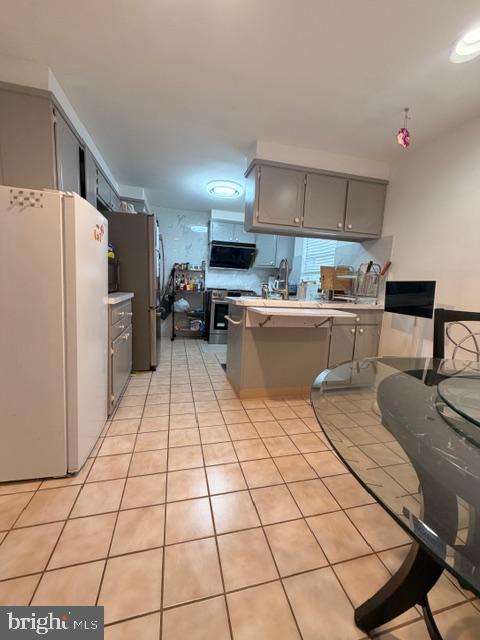 810 Kendrick Street Philadelphia, PA 19111 - Photo 14 of 45 a kitchen with a sink a stove and a refrigerator