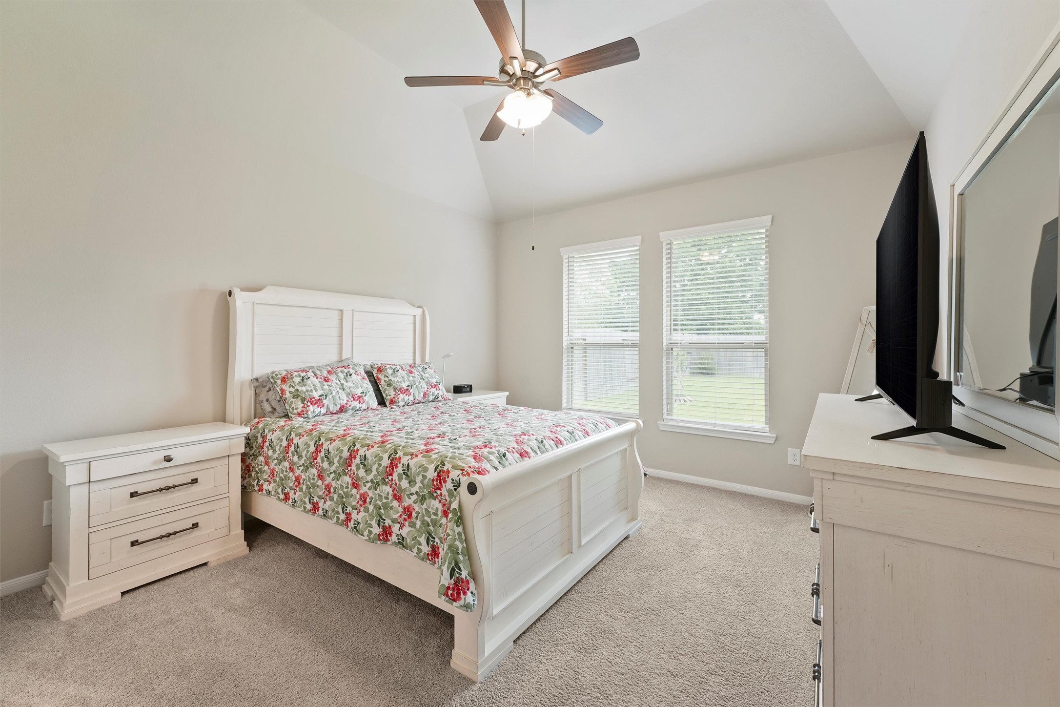 6318 Borage Street Crosby, TX 77532 - Photo 14 of 29 a bedroom with a bed closet and flat screen tv