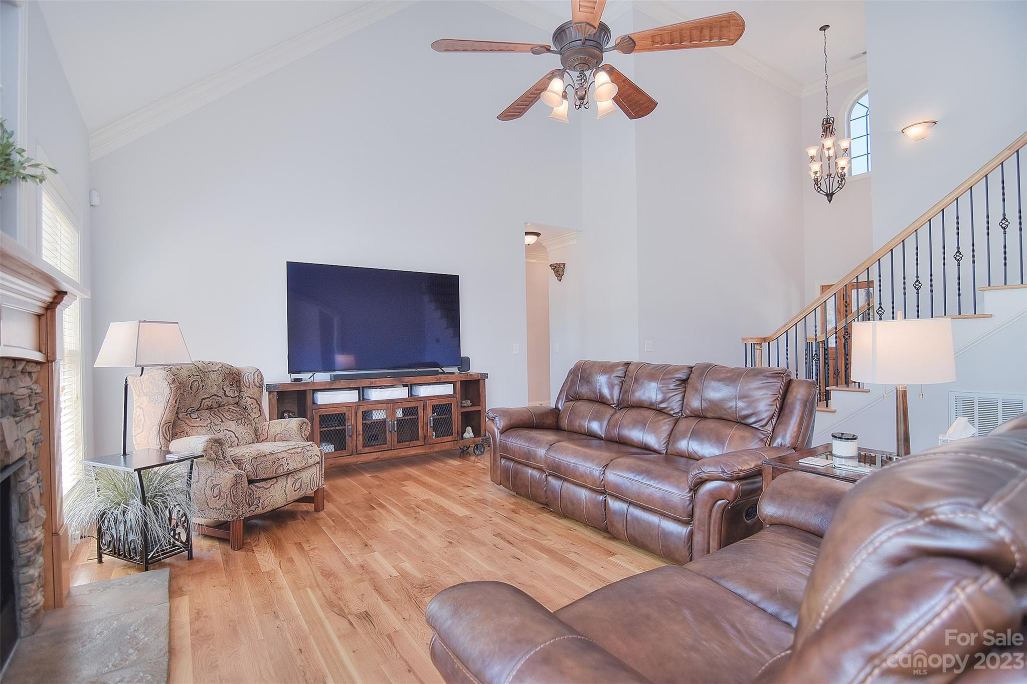 4913 Campobello Drive Monroe, NC 28110 - Photo 11 of 46 a living room with furniture ceiling fan and a wooden floor