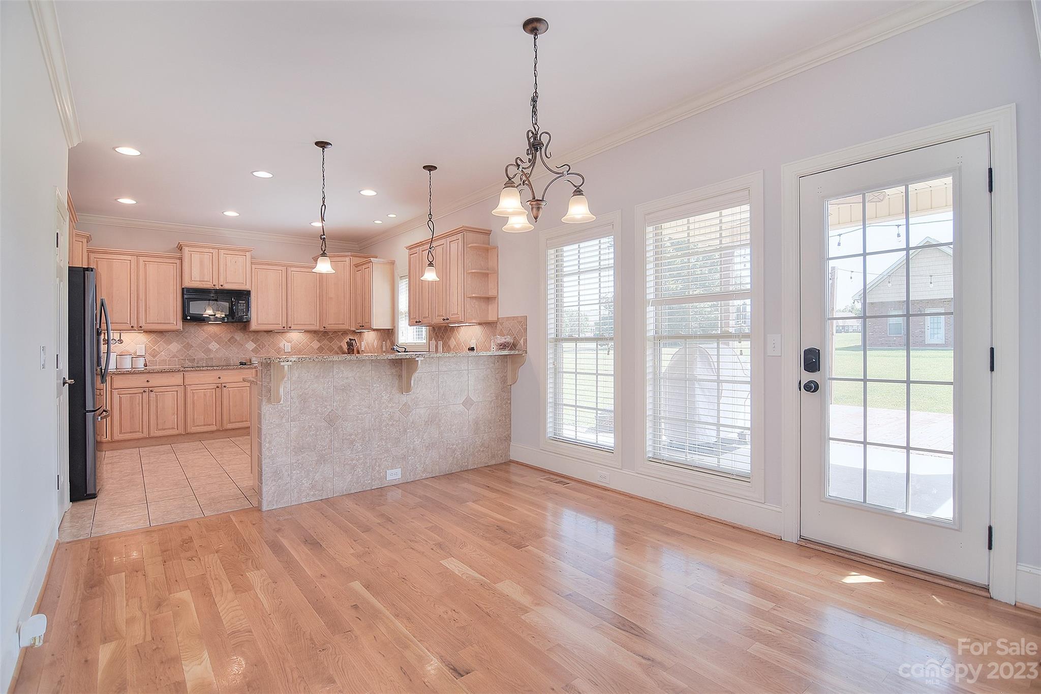 4913 Campobello Drive Monroe, NC 28110 - Photo 12 of 46 a view of a kitchen with marble kitchen and stainless steel appliances