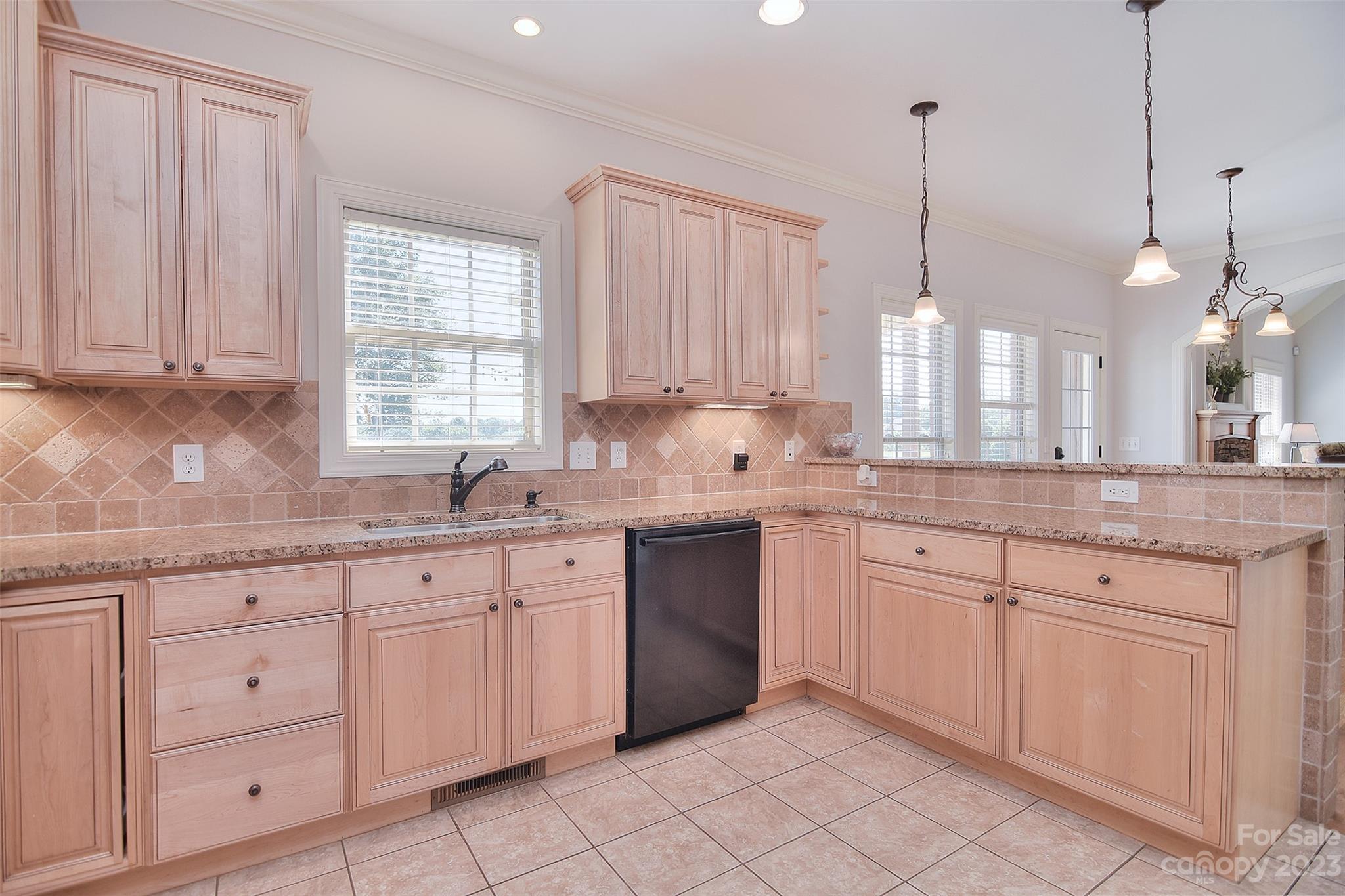4913 Campobello Drive Monroe, NC 28110 - Photo 15 of 46 a kitchen with white cabinets white appliances and sink