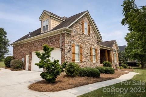 4913 Campobello Drive Monroe, NC 28110 - Photo 2 of 46 a front view of a house with garden
