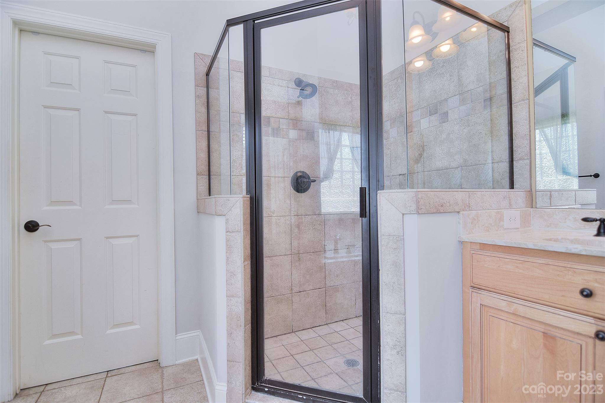 4913 Campobello Drive Monroe, NC 28110 - Photo 21 of 46 a bathroom with a shower and a sink