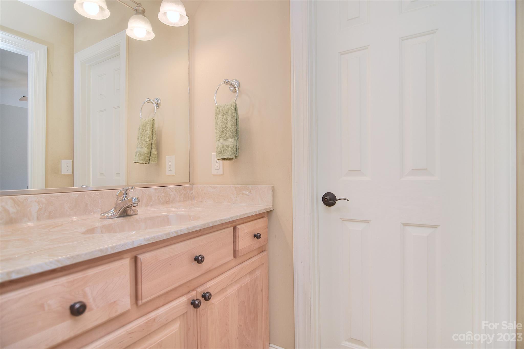 4913 Campobello Drive Monroe, NC 28110 - Photo 29 of 46 a bathroom with a granite countertop sink and a mirror